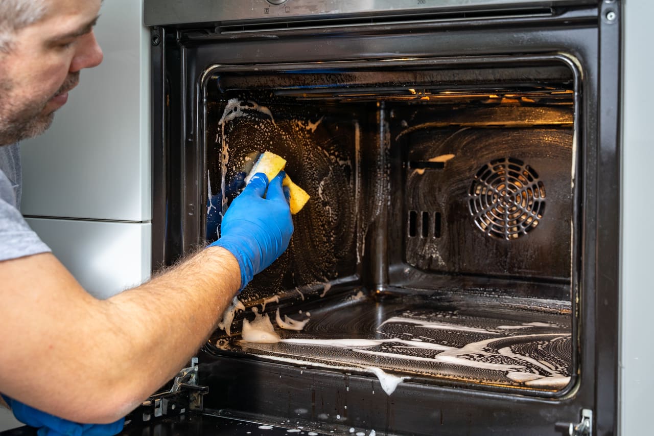 A detailed deep clean inside an oven.